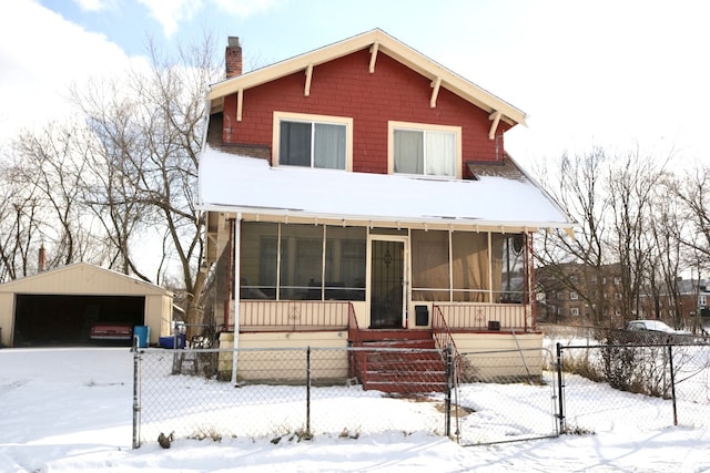 view of front of home with a porch, a sunroom, and a carport