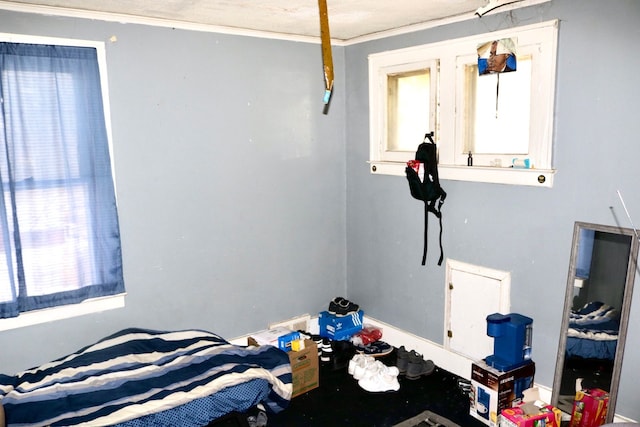 bedroom featuring crown molding