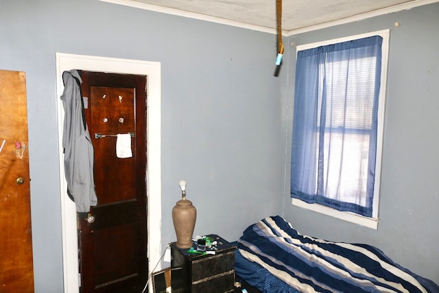 bedroom featuring crown molding