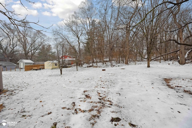 view of yard layered in snow