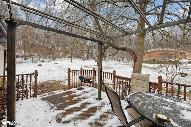 view of snow covered deck