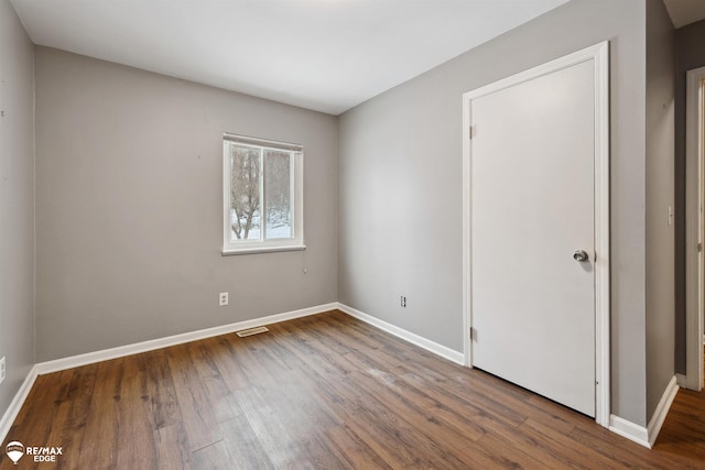 spare room featuring hardwood / wood-style floors