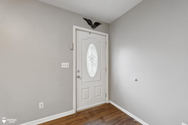 entryway with dark hardwood / wood-style flooring