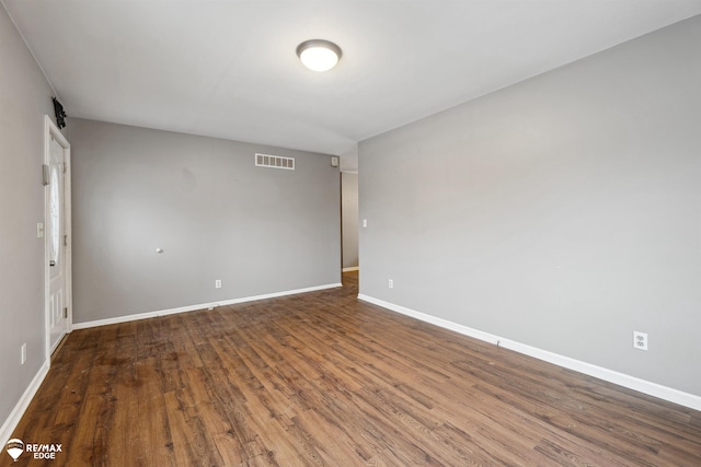 empty room featuring wood-type flooring