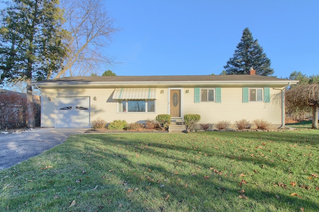 single story home with a front yard and a garage