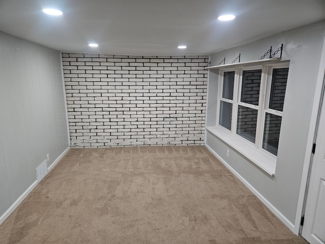 empty room featuring light colored carpet