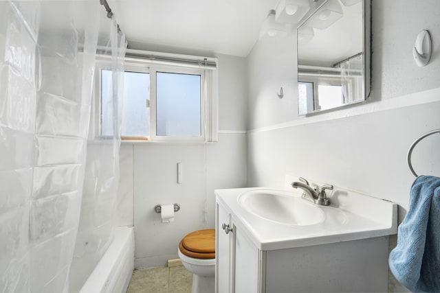 full bathroom with bathing tub / shower combination, vanity, and toilet