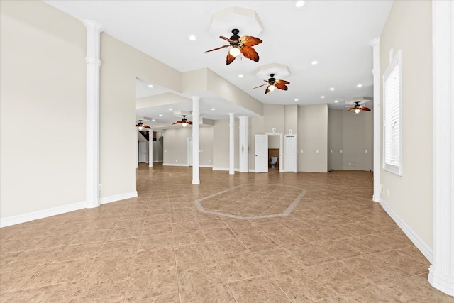 unfurnished living room featuring decorative columns