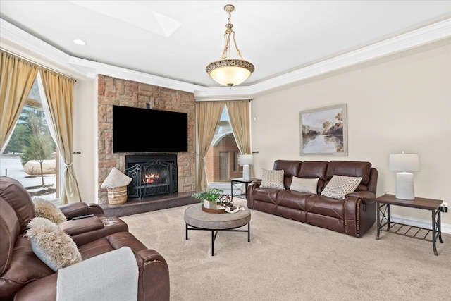 living room featuring carpet flooring, a raised ceiling, a stone fireplace, and ornamental molding