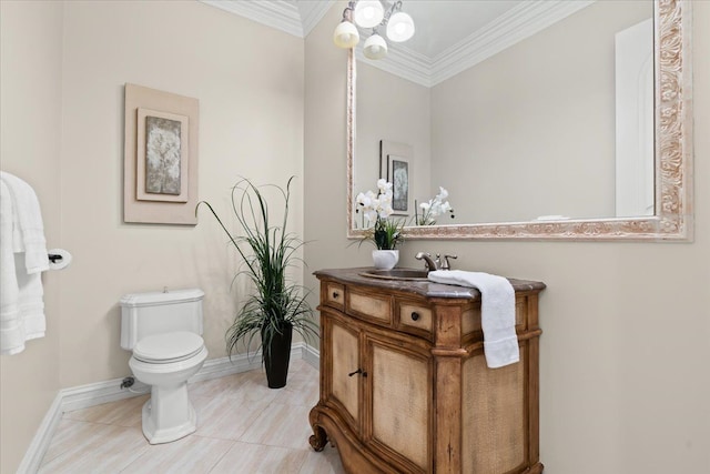 bathroom featuring crown molding, tile patterned flooring, vanity, and toilet