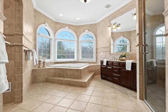 bathroom with ornamental molding, vanity, tile walls, and independent shower and bath