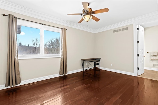 empty room with crown molding, ceiling fan, and dark hardwood / wood-style floors