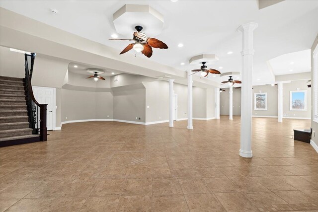 unfurnished living room with a towering ceiling and light tile patterned floors