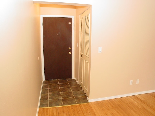 hall featuring dark wood-type flooring