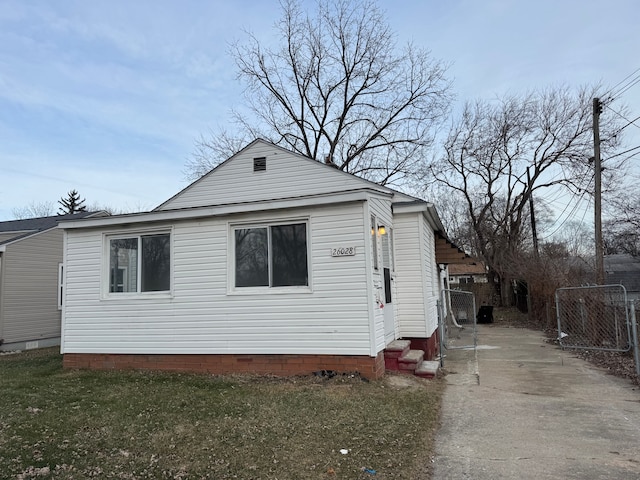 view of property exterior with a yard