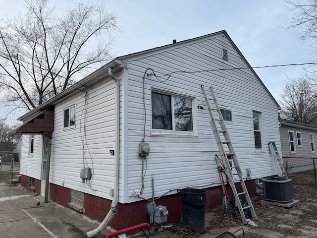 view of home's exterior with central AC unit