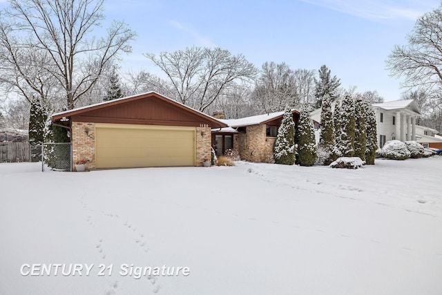 single story home featuring a garage