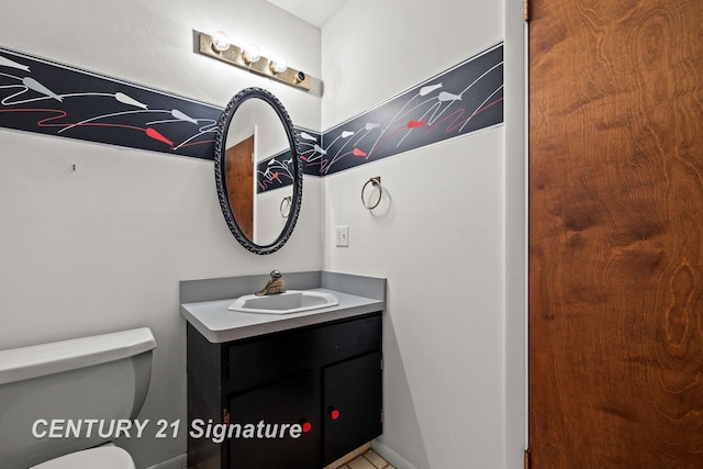 bathroom with vanity and toilet