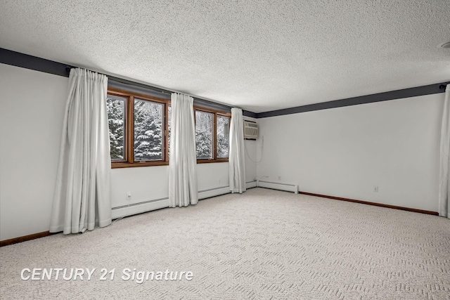 spare room with carpet, a wall mounted air conditioner, and a textured ceiling