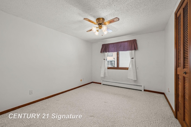 unfurnished bedroom with light carpet, a textured ceiling, ceiling fan, a baseboard heating unit, and a closet