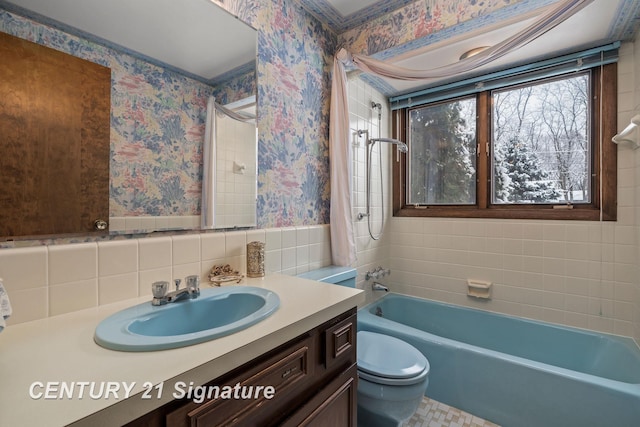 full bathroom featuring bathtub / shower combination, vanity, toilet, and tile walls