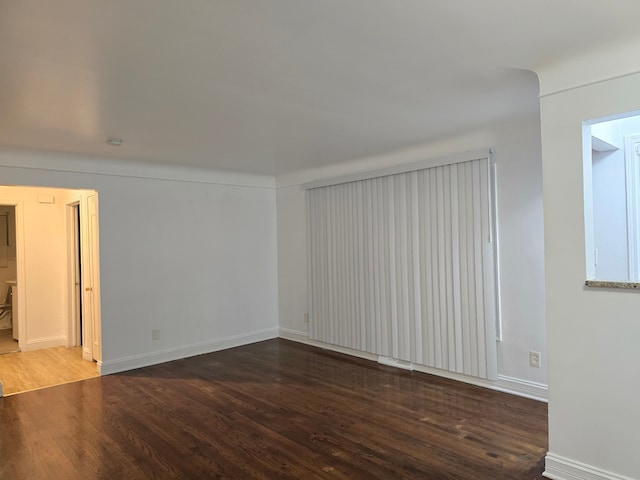 empty room featuring dark hardwood / wood-style floors