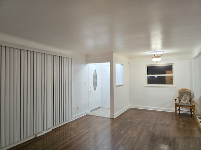 entryway with dark hardwood / wood-style flooring