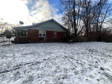 view of snow covered house