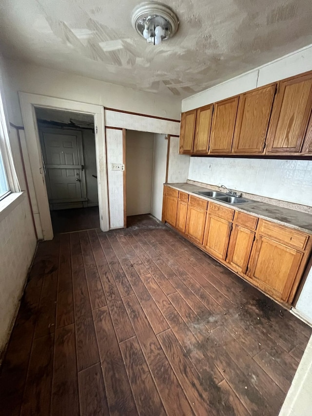 kitchen with dark wood-type flooring and sink