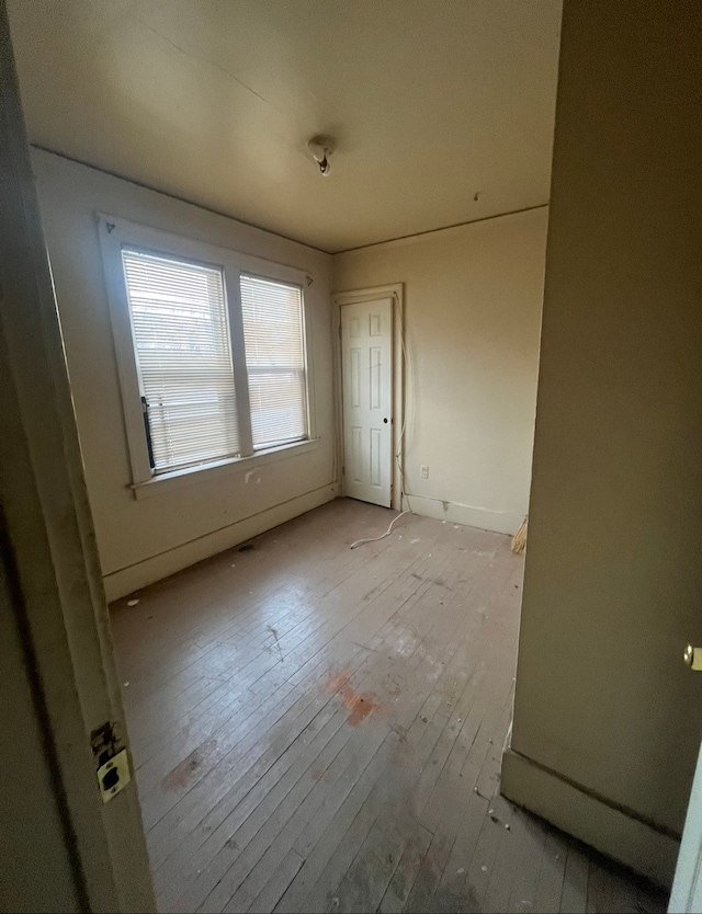 spare room with light wood-type flooring