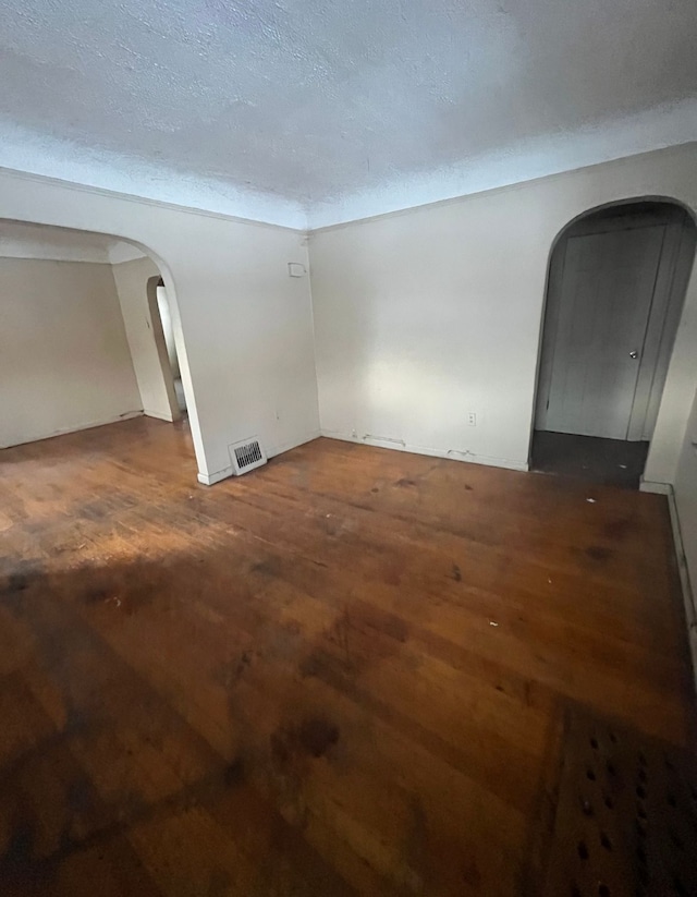 spare room with a textured ceiling