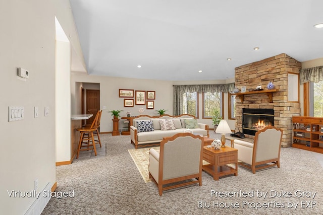 carpeted living room with a fireplace