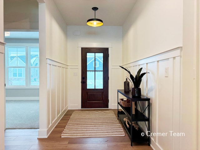 entryway featuring hardwood / wood-style flooring and plenty of natural light