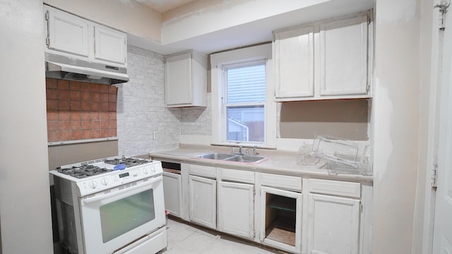 kitchen with sink, white cabinetry, and white range with gas stovetop