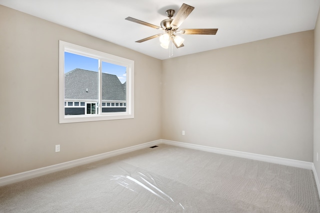 carpeted empty room with ceiling fan