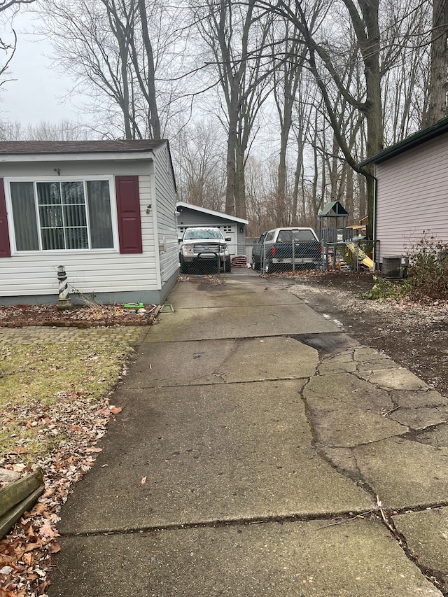 view of side of home with central air condition unit