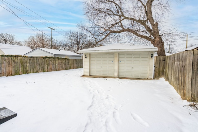 view of snow covered garage