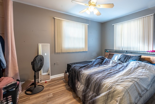 bedroom featuring ceiling fan and light hardwood / wood-style floors