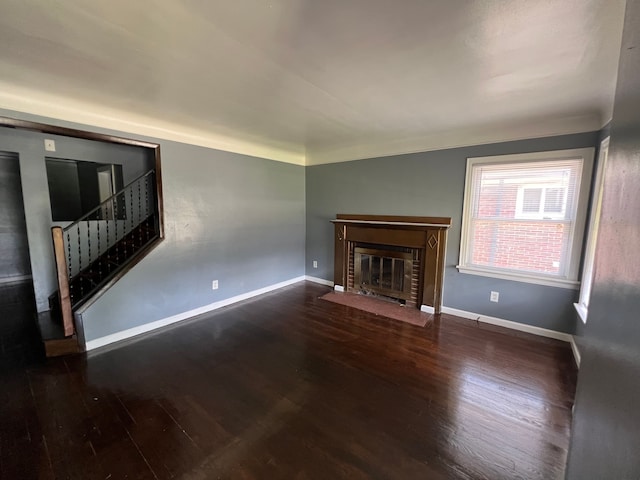 unfurnished living room with wood-type flooring