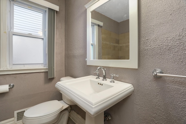 bathroom with toilet and sink