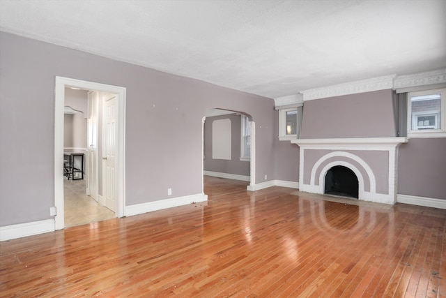 unfurnished living room with light hardwood / wood-style flooring