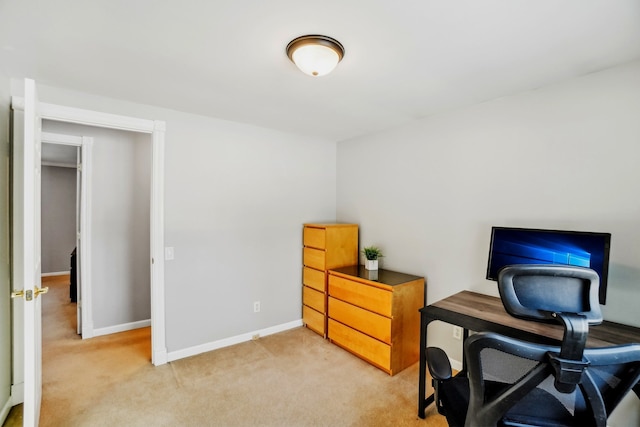 office space with carpet and baseboards