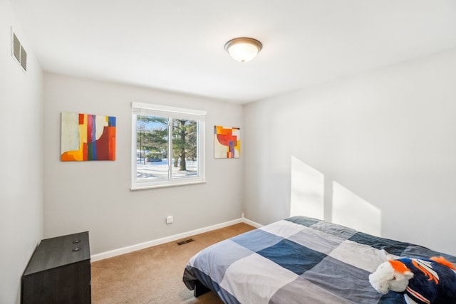 bedroom with carpet flooring, visible vents, and baseboards