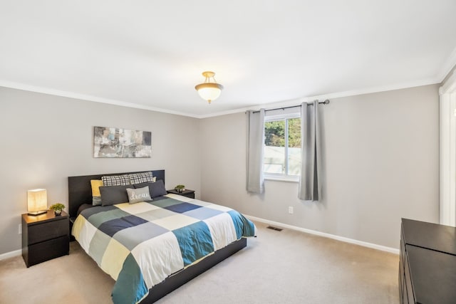 bedroom featuring baseboards, visible vents, ornamental molding, and light colored carpet