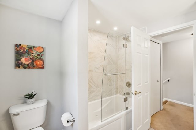 bathroom with toilet, bathtub / shower combination, baseboards, and recessed lighting