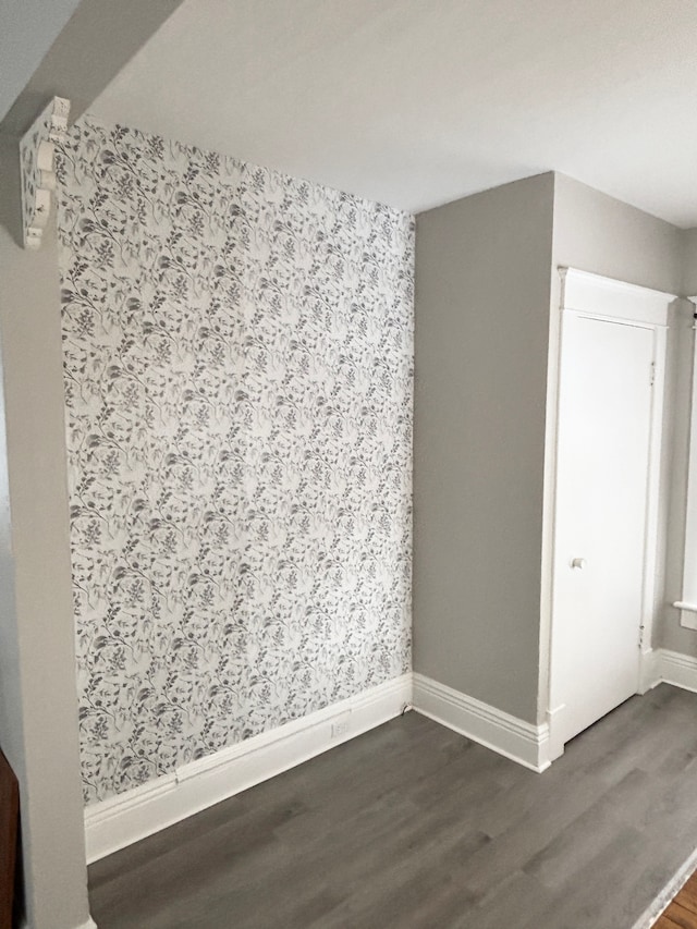 spare room featuring dark hardwood / wood-style flooring