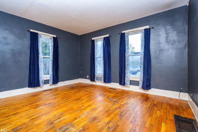 empty room with wood-type flooring