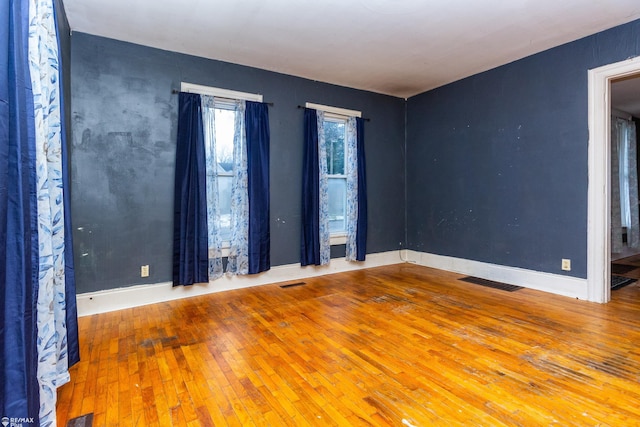 spare room featuring hardwood / wood-style floors