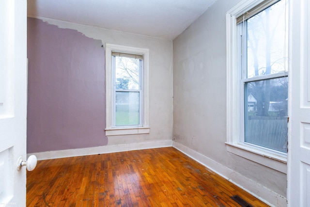 unfurnished room featuring dark wood-type flooring