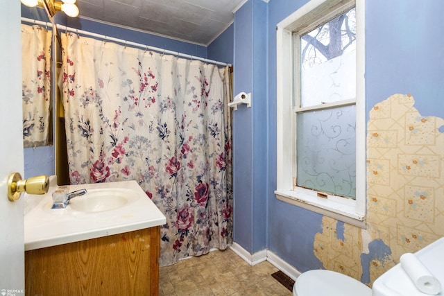 bathroom with vanity and toilet